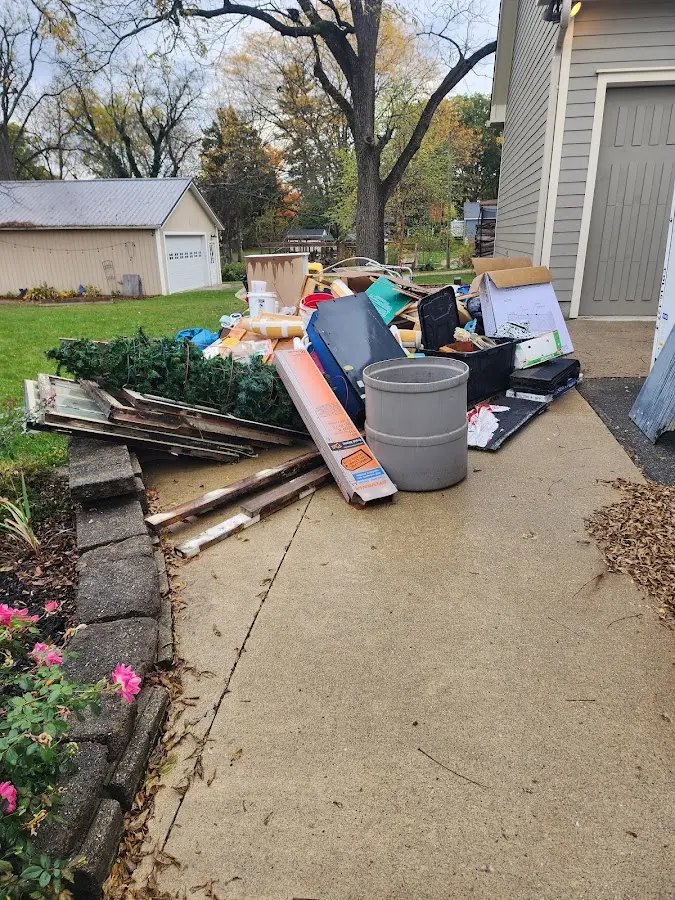 Dumpster being loaded with debris for Commercial Dumpster Rental in Vandenberg Village